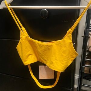 Kittenish bathing suit top. Yellow. Small. Tags on. No padding.